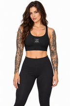 AI-generated tattooed female model wearing Women's Active Bra Top with Minimalist Spider Graphic