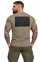 AI-generated tattooed male model wearing Black American Flag Performance T-Shirt — rear view